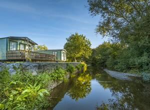 Riverside luxury holiday lodges at Arrow Bank photo