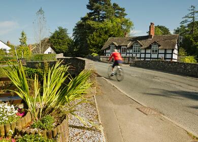 Cycling through Eardisland, Herefordshire