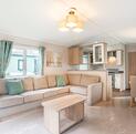 Willerby Avonmore holiday home for sale on riverside plot at Arrow Bank. Living area photo