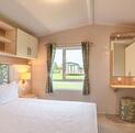 Willerby Avonmore holiday home for sale on riverside plot at Arrow Bank. main bedroom photo