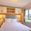 Willerby Avonmore holiday home for sale on riverside plot at Arrow Bank. main bedroom photo