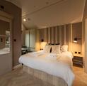 The Lumiere luxury couples retreat accommodation at Arrow Bank, 5 star holiday park - bedroom photo